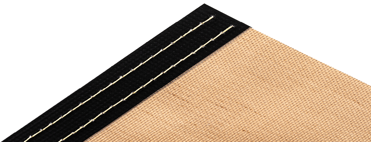 Fabric edge sewn and sealed reinforcement